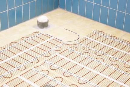 Как сделать электрический теплый пол под плитку: плёночный и кабельный вариант с фото